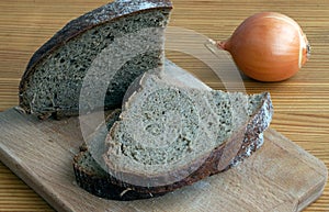 Black bread slices on the cutting board
