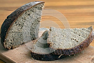 Black bread slices on the cutting board