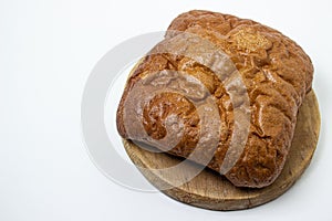 Black bread on a white background. Borodino bread. Homemade baking.