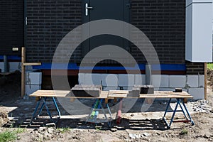 Black bricks on a wooden trestle