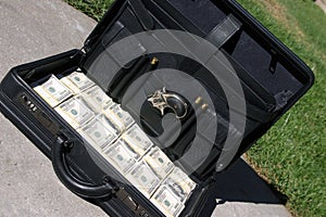 Black briefcase full of cash