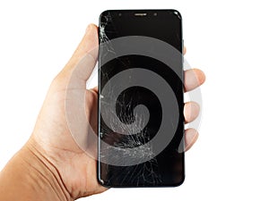 Black broken phone in hand on white background cracked touchscreen screen   isolate