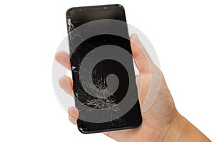 Black broken phone in hand on white background cracked touchscreen screen   isolate