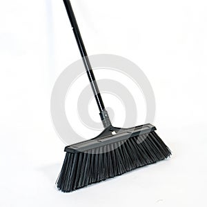 Black broom isolated on white background
