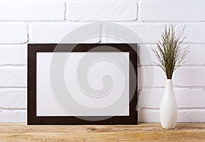 Black brown landscape frame mockup with dark grass in elegant v