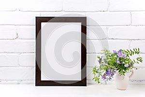 Black brown  poster frame mockup with purple bird vetch