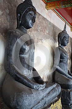 Black buddha at Wat Suthat Thep Wararam is a Buddhist temple in Bangkok, Thailand