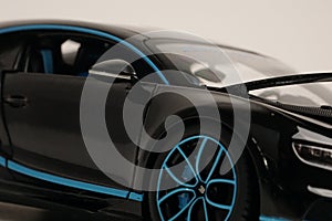 Black Bugatti Chiron with blue trim toy car photo