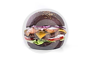 Black burger, gamburger isolated on white background. Restaurant dish. Tasty Gamburger with bacon, beef meat, cheese