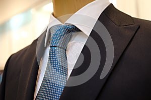Black business suit with a white shirt and with a blue tie in drawing