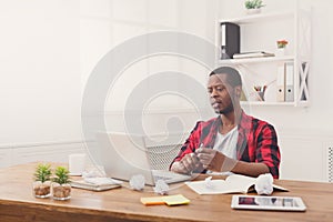 Black businessman in casual office, work with laptop