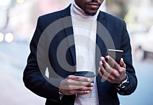 Black businessman, fashion and hands with smartphone and coffee for connection, travel or work break. Formal, male