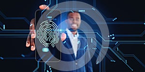 Black businessman holding smartphone, glowing fingerprint hud and digital lines