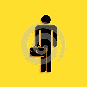 Black Businessman man with briefcase icon isolated on yellow background. Long shadow style. Vector