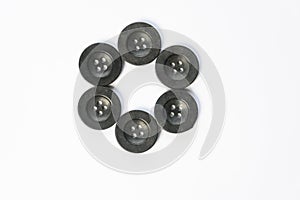 black buttons for sewing on a white background