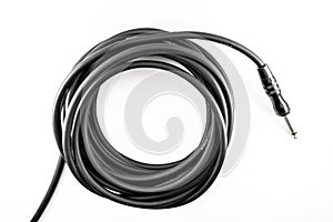 black cable for electric acoustic guitar isolated white background, music equipment