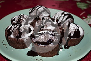 Black cake with chocolate icing on a