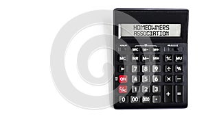 Black calculator with text Homeowners Association on the white background