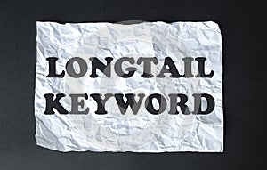 Black calculator with text Longtail Keyword on the white background