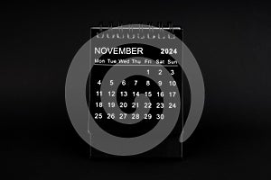 Black Calendar for November 2024 . Desktop calendar on a black background