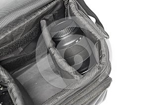 Black camera bag on open, have camera lens white background