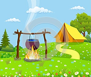 Black camping pot over a bonfire