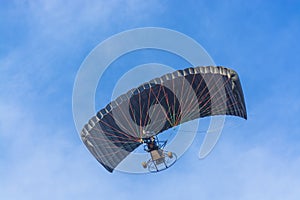 Black canopy powered tandem para glider