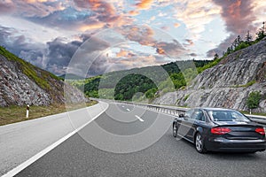 Black car on asphalt road