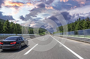 Black car on asphalt road