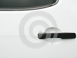 Black car door handle on white background. Automobile and texture concept. Automotive industry and safety lock and remote key