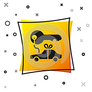 Black Car gift icon isolated on white background. Car key prize. Yellow square button. Vector