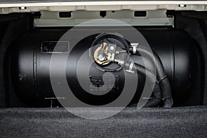 Black car liquefied petroleum gas, LPG tank with meter close up photo