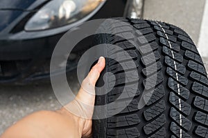 Black car`s new tyre