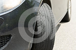 Black car`s new tyre