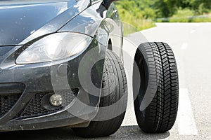 Black car`s new tyre