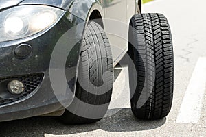 Black car`s new tyre