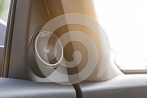 Black car speaker mounted inside the car