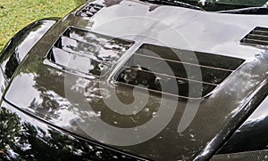 Black Carbon fiber of a racing Car front cover