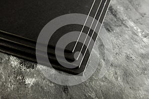 Black cardboard sheets stacked
