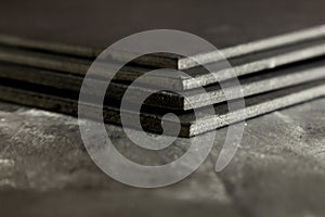 Black cardboard sheets stacked