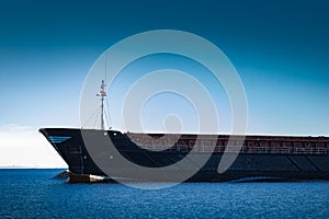 Black cargo ship`s bow