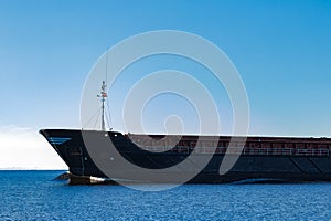 Black cargo ship`s bow