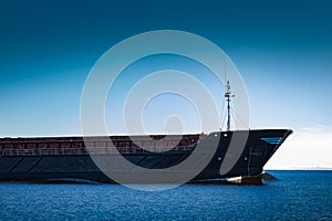 Black cargo ship`s bow