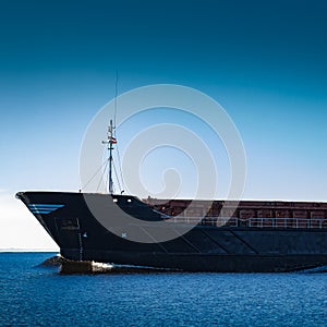Black cargo ship`s bow