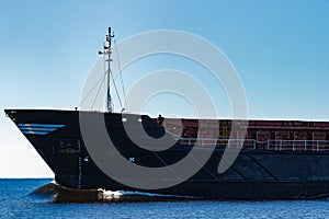 Black cargo ship`s bow