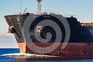Black cargo ship`s bow