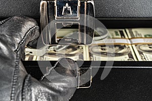 Black case full of dollar bills close up.Money bricks in case