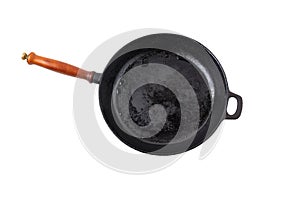 Black cast-iron frying pan with wooden handle