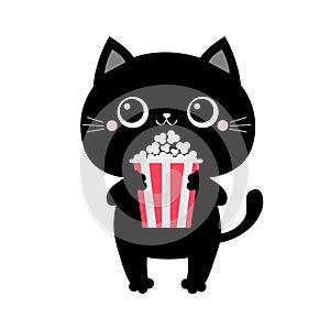 Black cat holding eating popcorn. Cinema theater. Cute cartoon kawaii funny baby character. Film show. Kitten watching movie. Flat