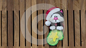Black cat with santa claus hat inside a green boot made in foamy for christmas decoration